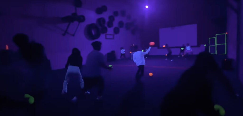 Students playing glow-in-the-dark dodgeball